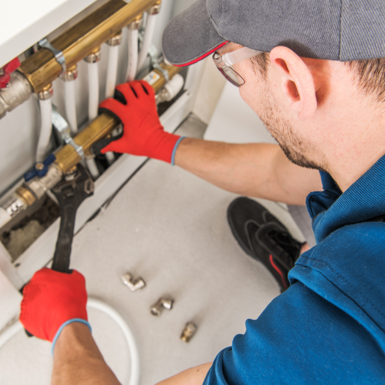 plumber inspecting plumbing pipes